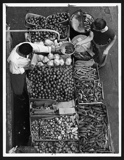 Overhead view of a produce stand with vendors