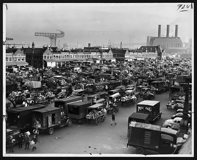 Vast crowd of trucks and horse-drawn carts at a market