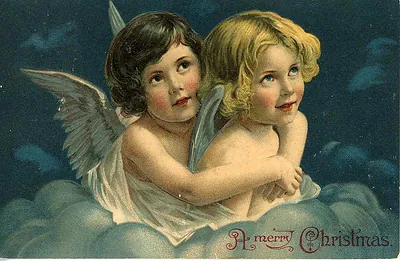 Vintage Christmas postcard with two angels on clouds