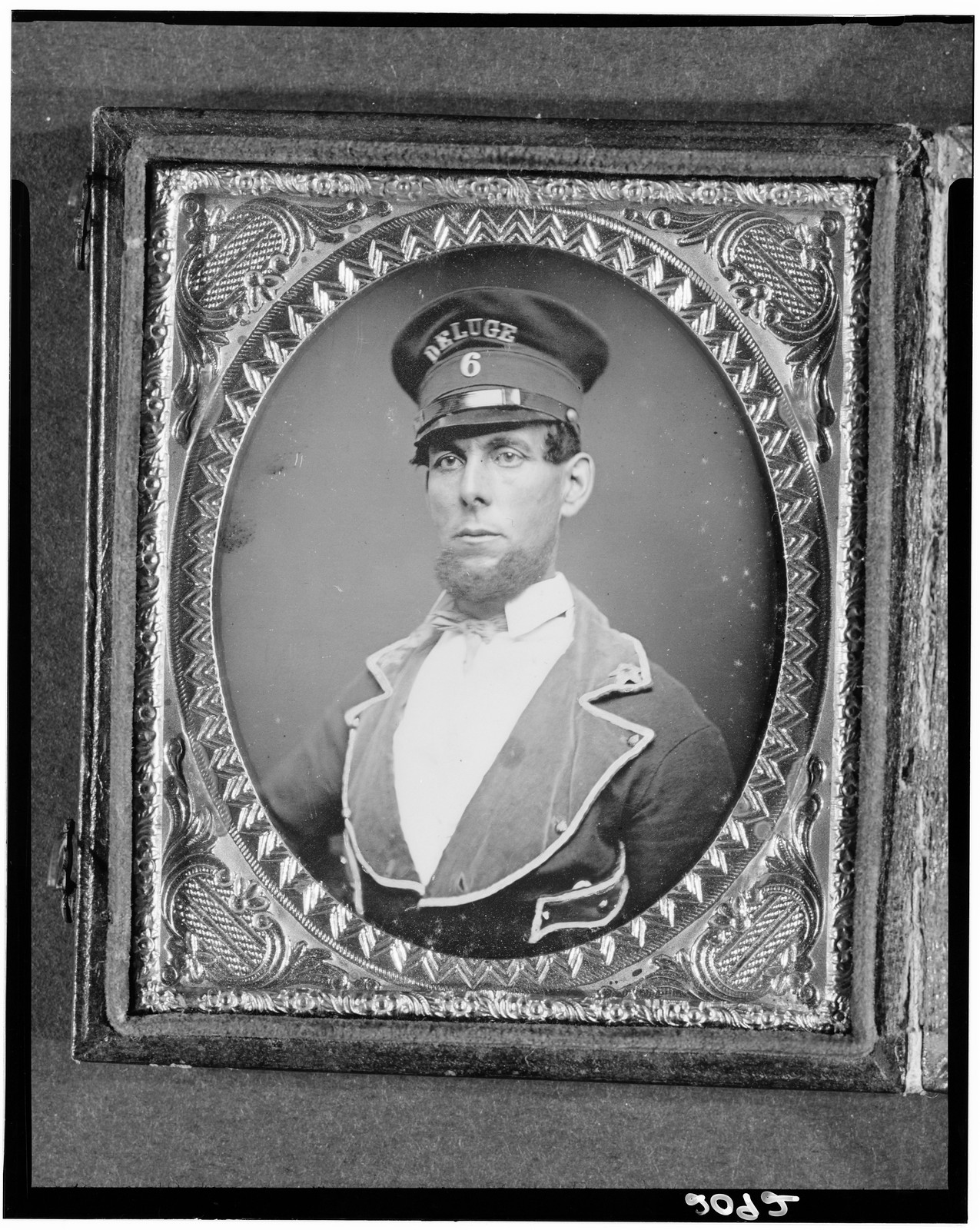 Portrait of a fireman wearing a Deluge No. 6 cap, 1840 — historic photograph