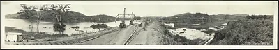 Panoramic photograph of Panama Canal works with railway embankment and bridge
