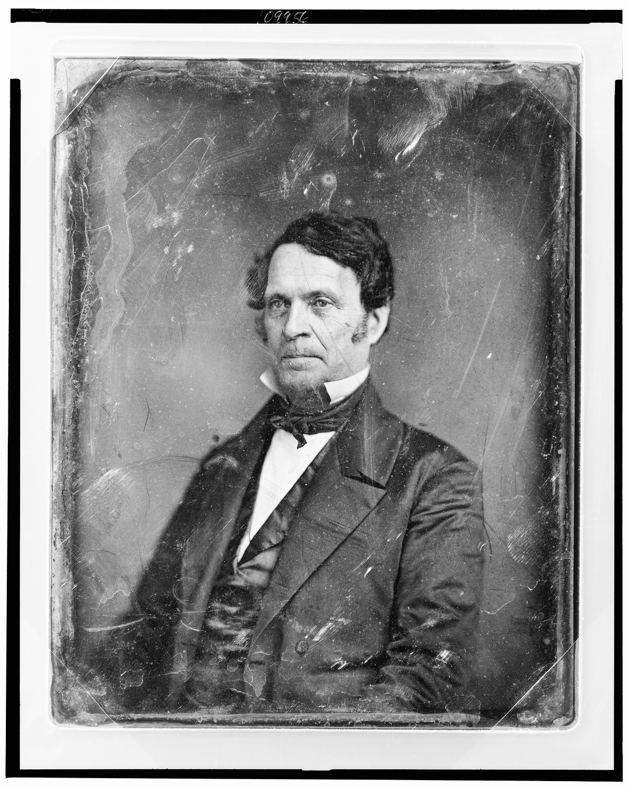 Daguerreotype portrait of a man in dark suit and cravat, 1844 — historic photograph