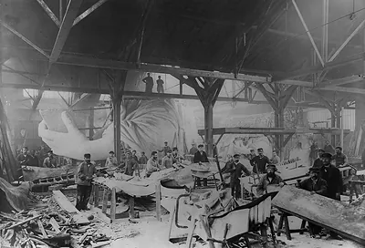 [Workmen constructing the Statue of Liberty in Bartholdi's Parisian warehouse workshop; first model; left hand; and quarter-size head--Winter 1882?]