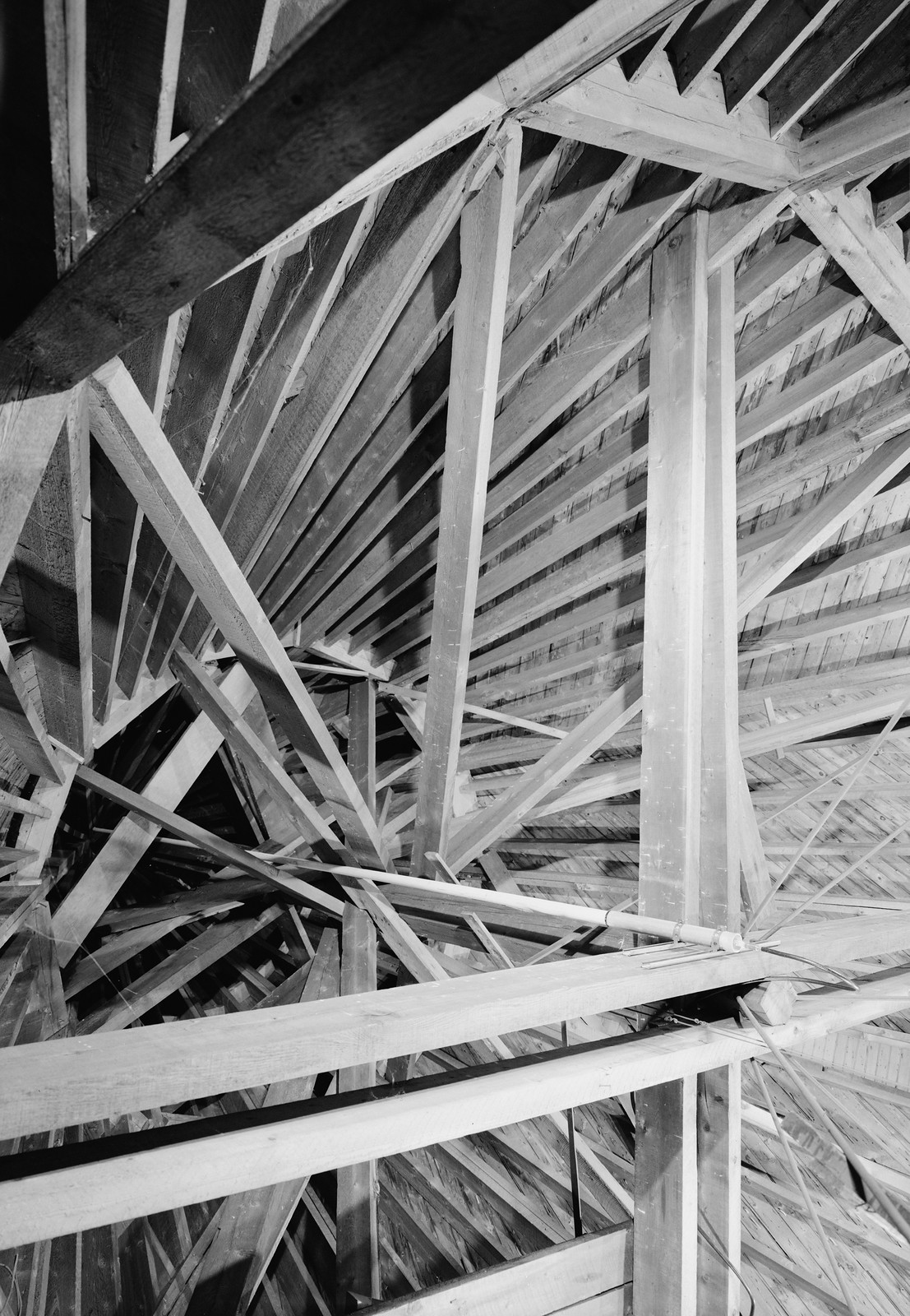 Interior view of timber roof framing, black and white photograph — historic photograph