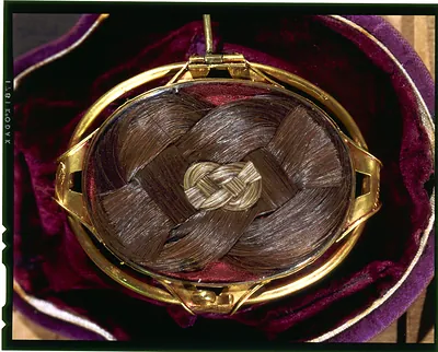 [Verso of oval portrait miniature in gold case, showing James Madison's hair in braided pattern]