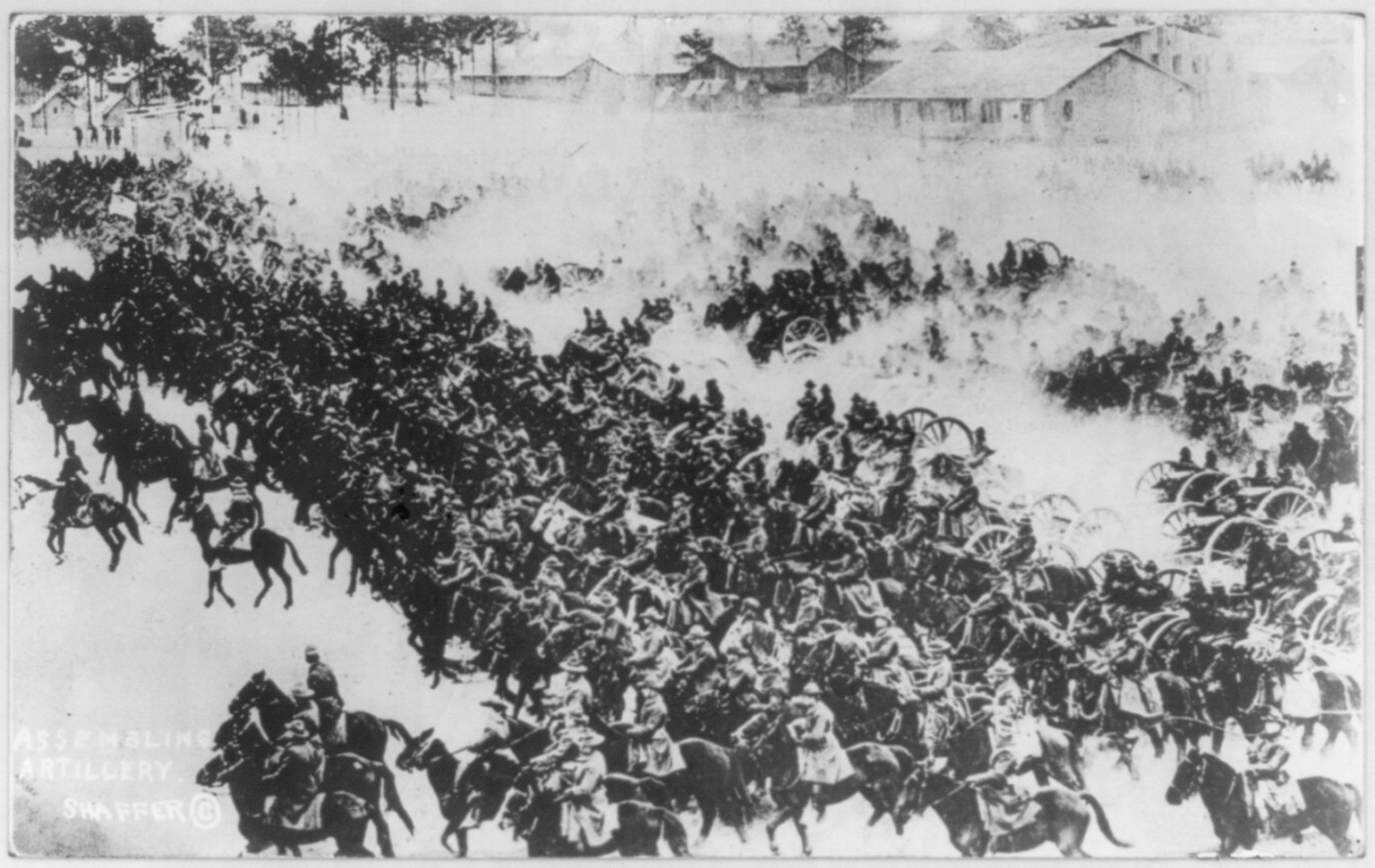 [Mass of horse-drawn U.S. artillery advancing under cloud of dust - training scene?], c1919. — historic photograph