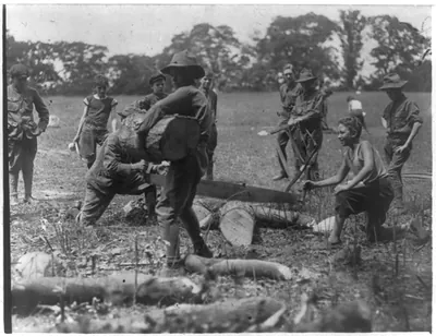 Boy Scouts [of the New York City area] at Hunter's Island: Sawing wood
