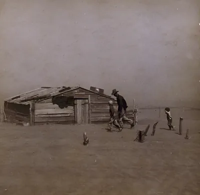 Farmer and sons walking in the face of a dust storm. Cimarron County, Oklahoma
