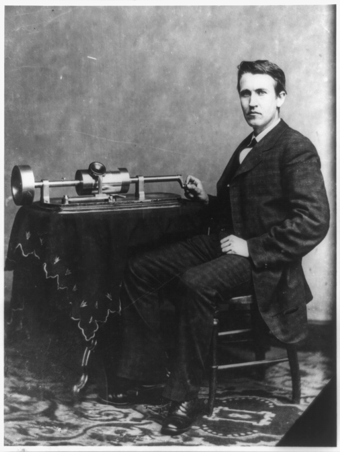 [Thomas Edison, full-length portrait, seated, facing front, with phonograph], [ca. 1878] — historic photograph