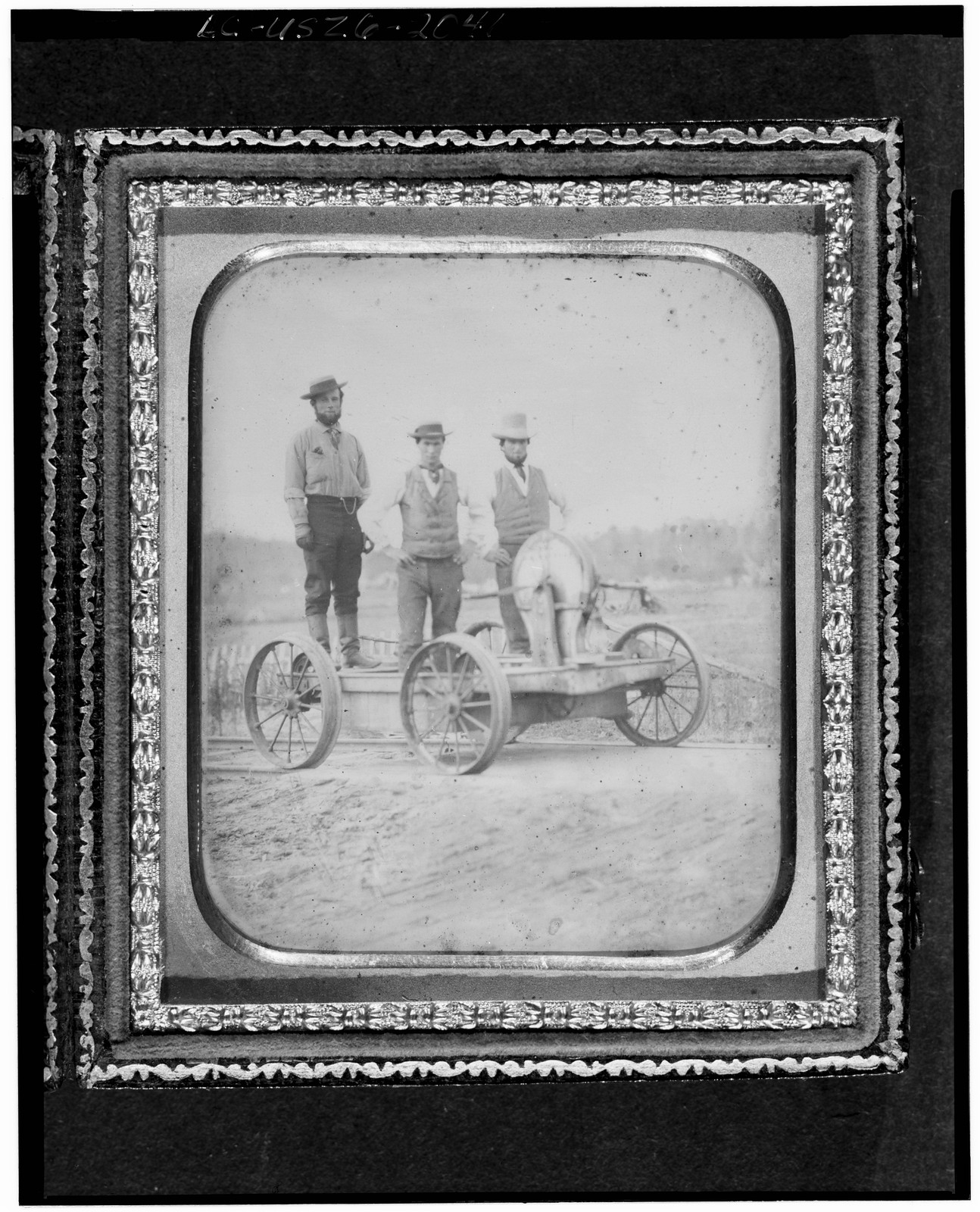 Three men posing on a railway handcar, daguerreotype, 1850 — historic photograph