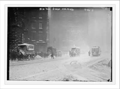 Horse-drawn wagons on snowy street, NY snow storm