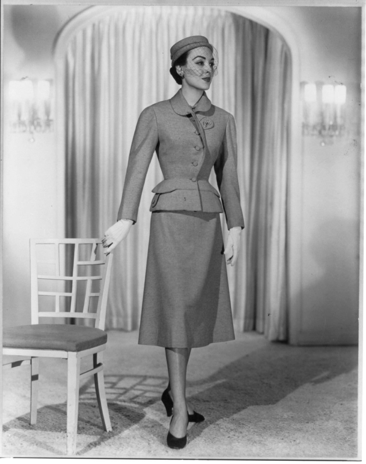 Women modeling fashions 1951-1952: Light Carnegie blue" suit from Hattie Carnegie's fall and winter 1951-52 collection", ca.1951 — historic photograph