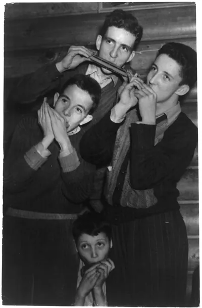 [3 boys of an orphanage in West Virginia playing folk tunes on harmonicas as their contribution to the National Folk Festival, Philadelphia]