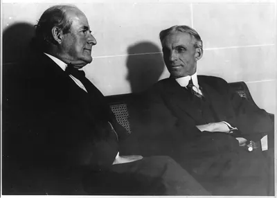 The two peace advocates, Bryan and Ford, discussing the final plans of the Ford Peace Ship Expedition. Bryan telling Ford he will meet him at the Hague