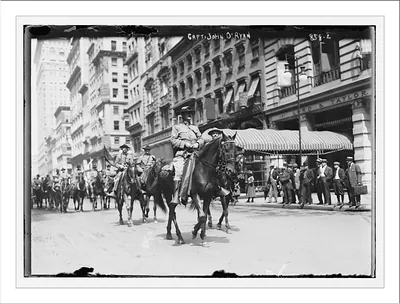 Capt. John O'Ryan, on horse-back, leading 1st Battery to war game, New York