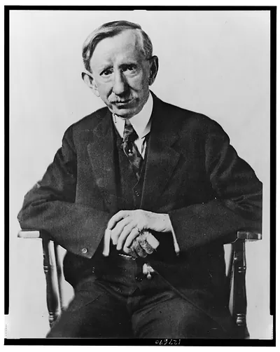 [Frank George Carpenter, three-quarter length portrait, seated, facing front]
