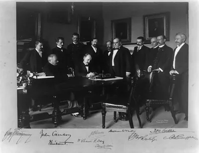 Cabinet Room, White House, Aug. 12, 1898. Secy. of State William R. Day signing