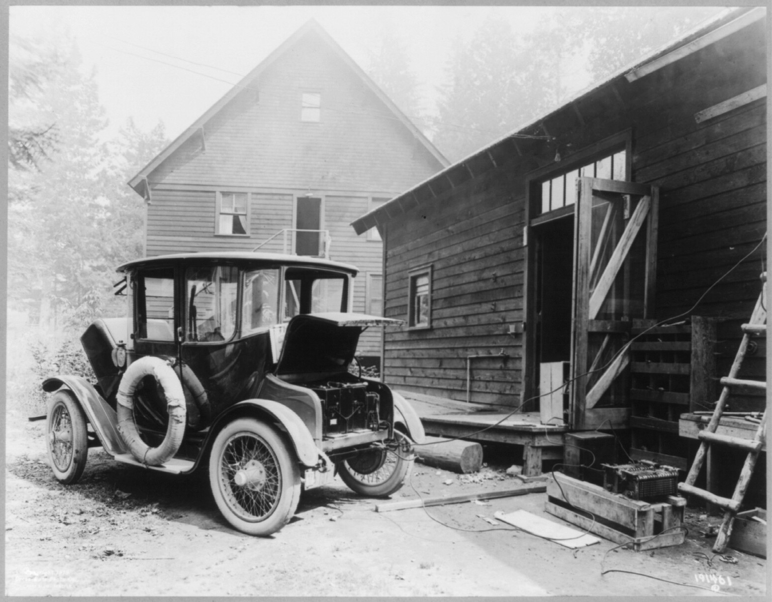 [Electric auto at re-charging station], c1919 Aug. 25. — historic photograph
