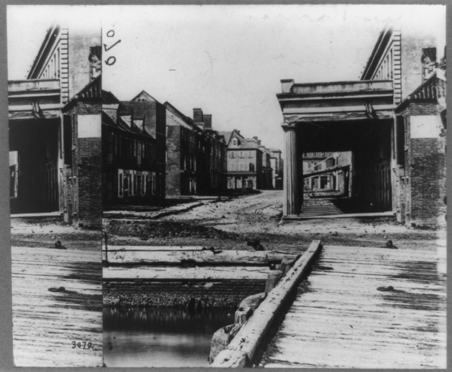 Vendue Range, Charleston, S.C.--The building on the left is where the first shell struck the city, [photographed 1863 April, printed later] — historic photograph