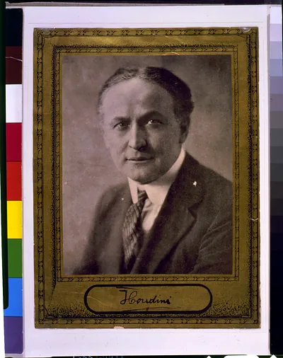 [Houdini, a mature statesman of magic, head-and-shoulders portrait, facing front]