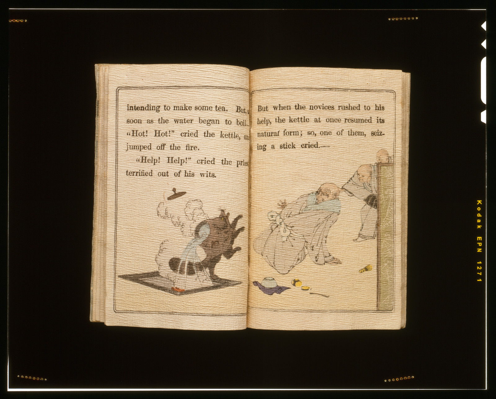 Open illustrated book showing the kettle and tanuki story — historic print