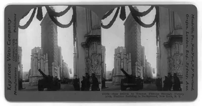 Gun Driven by Tractor, Passing Through Victory Arch, Flatiron Building in Background, New York, N.Y.