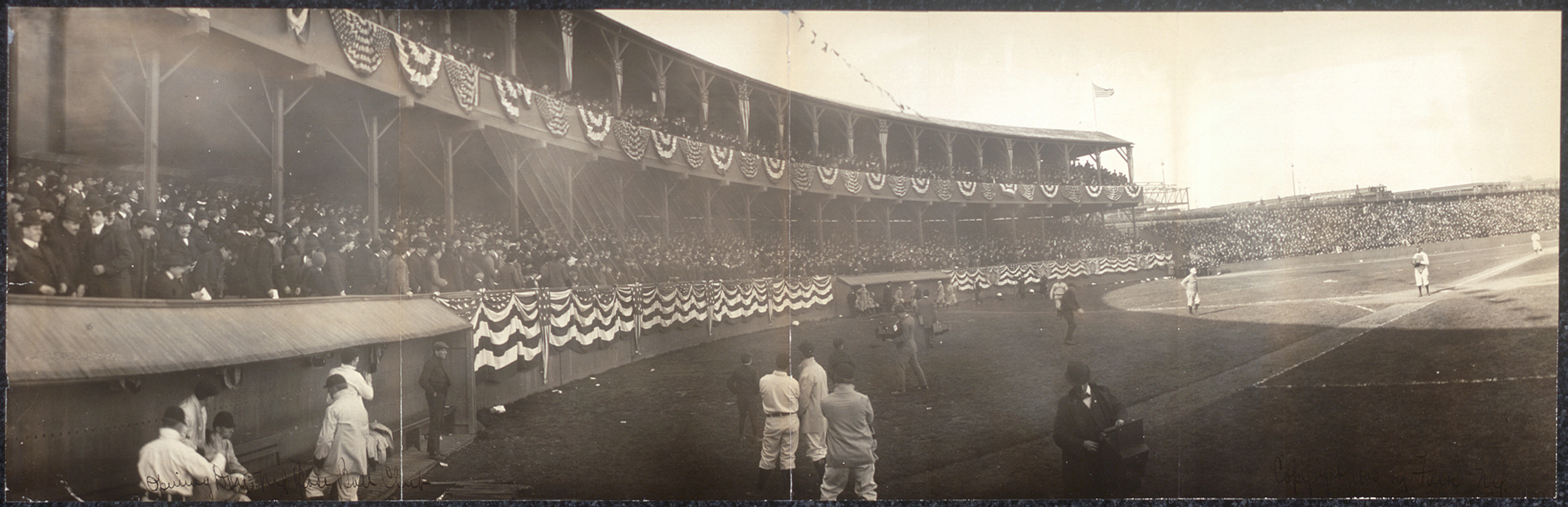 Panoramic view of a baseball park with crowds and bunting — historic image
