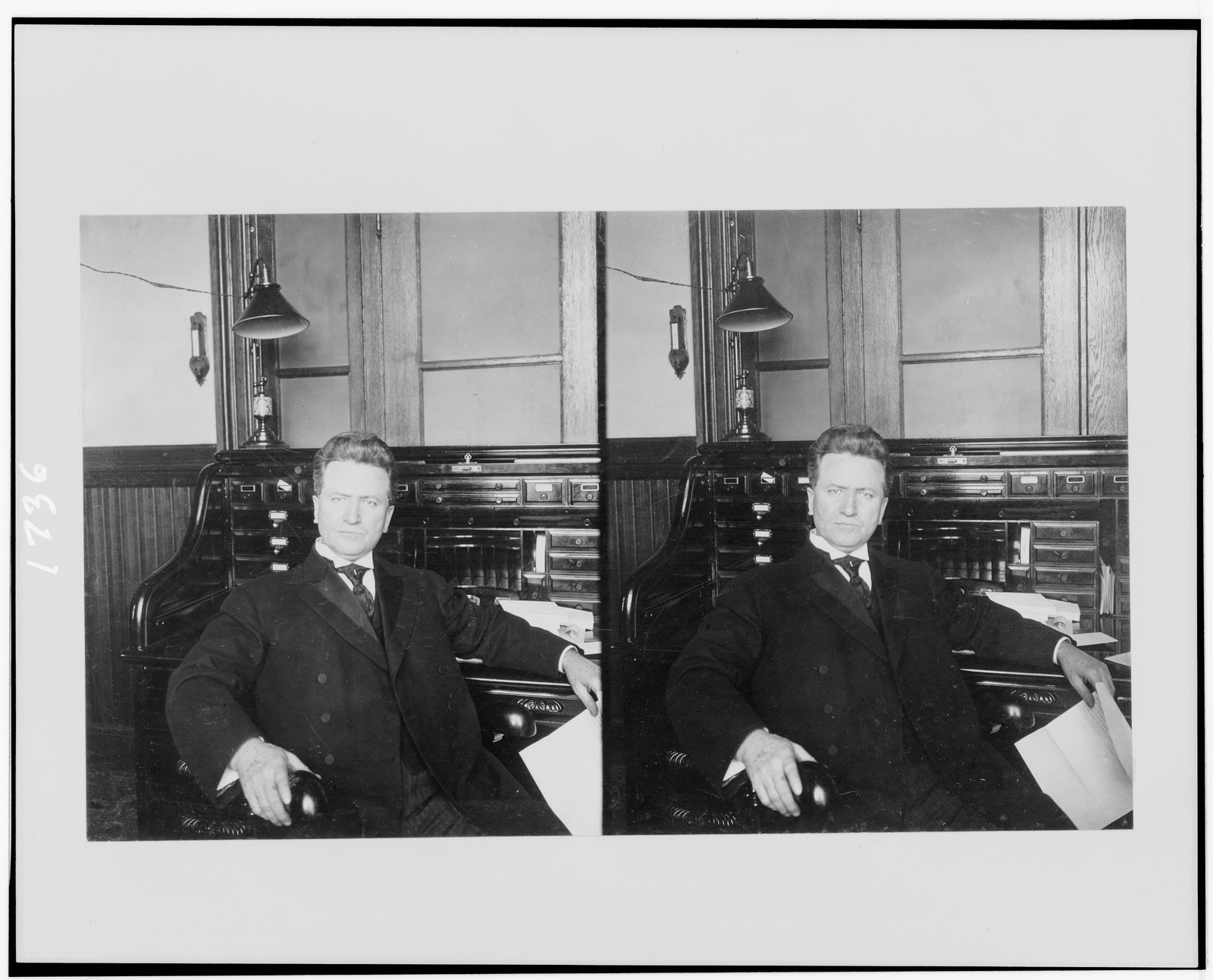 [Robert La Follette, half-length portrait, seated at desk, facing front], c1906. — historic photograph
