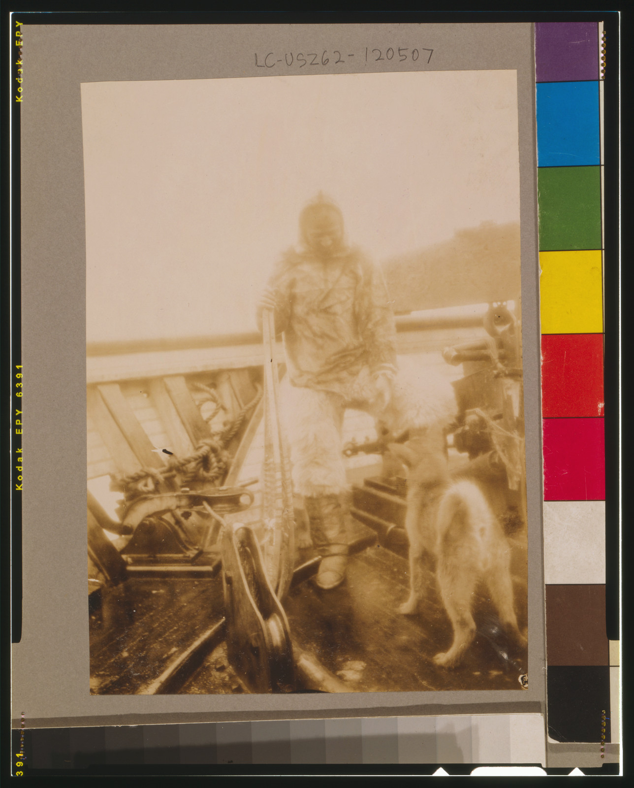 Matt Henson (of Peary's crew) in Arctic costume on deck of the Roosevelt" on arrival at Sidney, c1906. — historic photograph