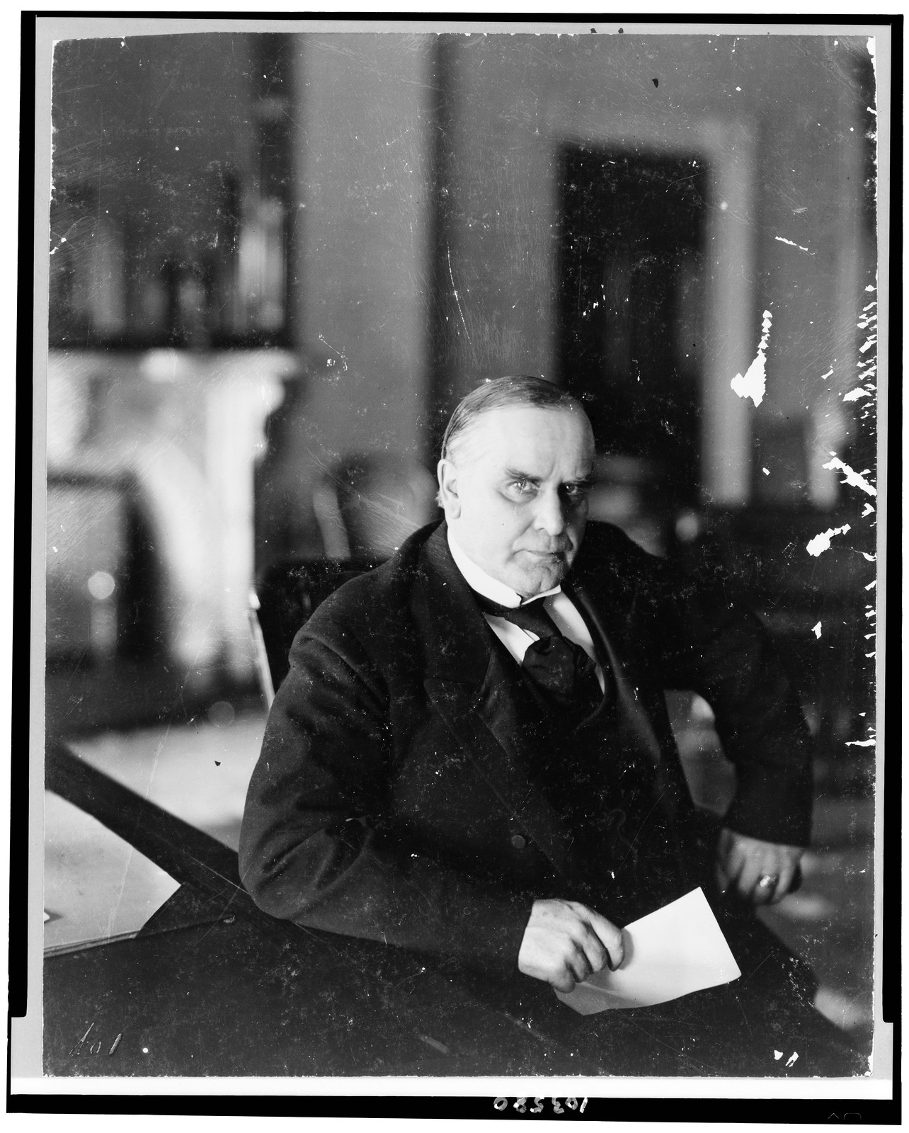 [William McKinley, half-length portrait, seated at desk, facing right], c1898. — historic photograph