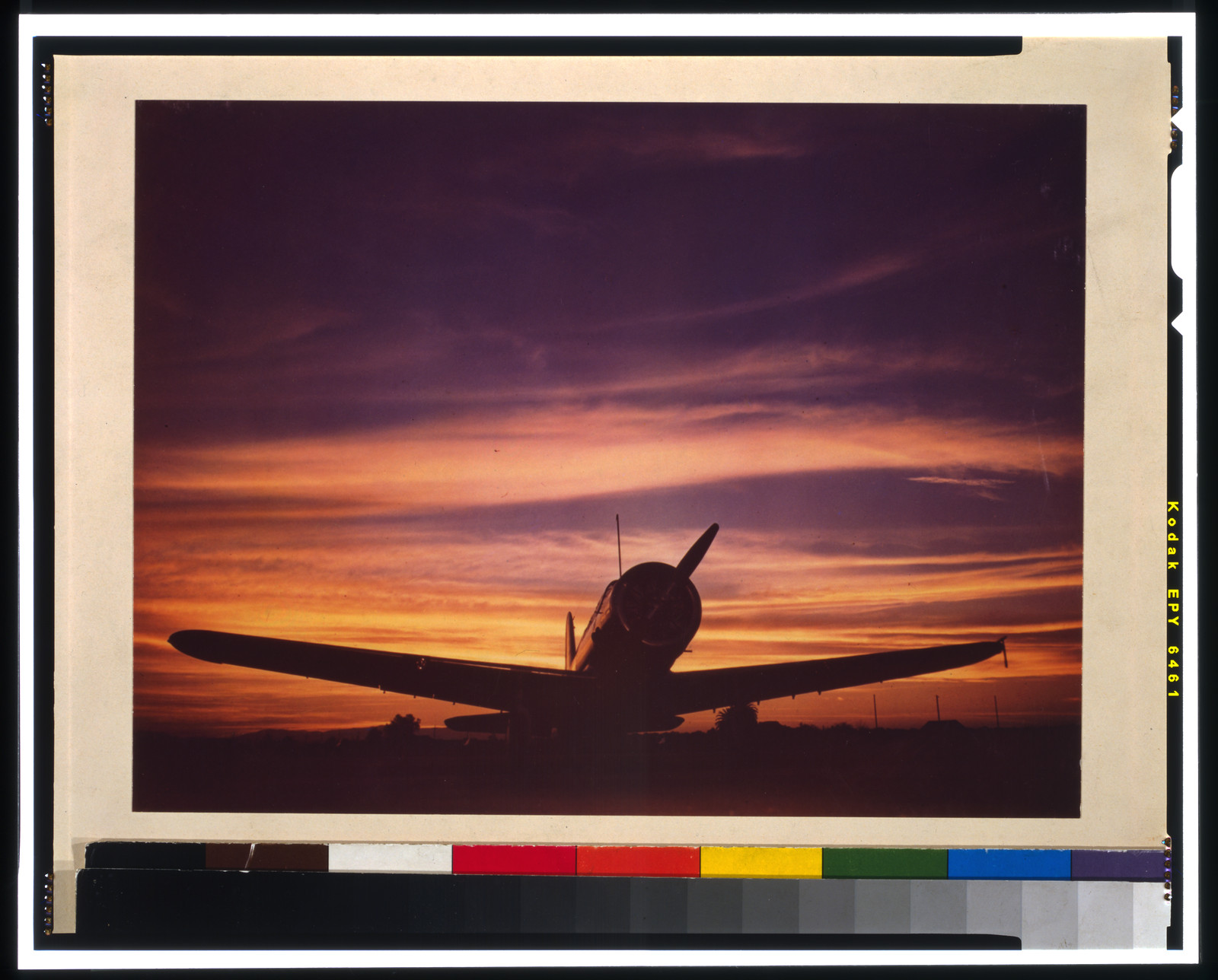 [Military airplane on tarmac at sunset], [between 1945 and 1947] — historic photograph