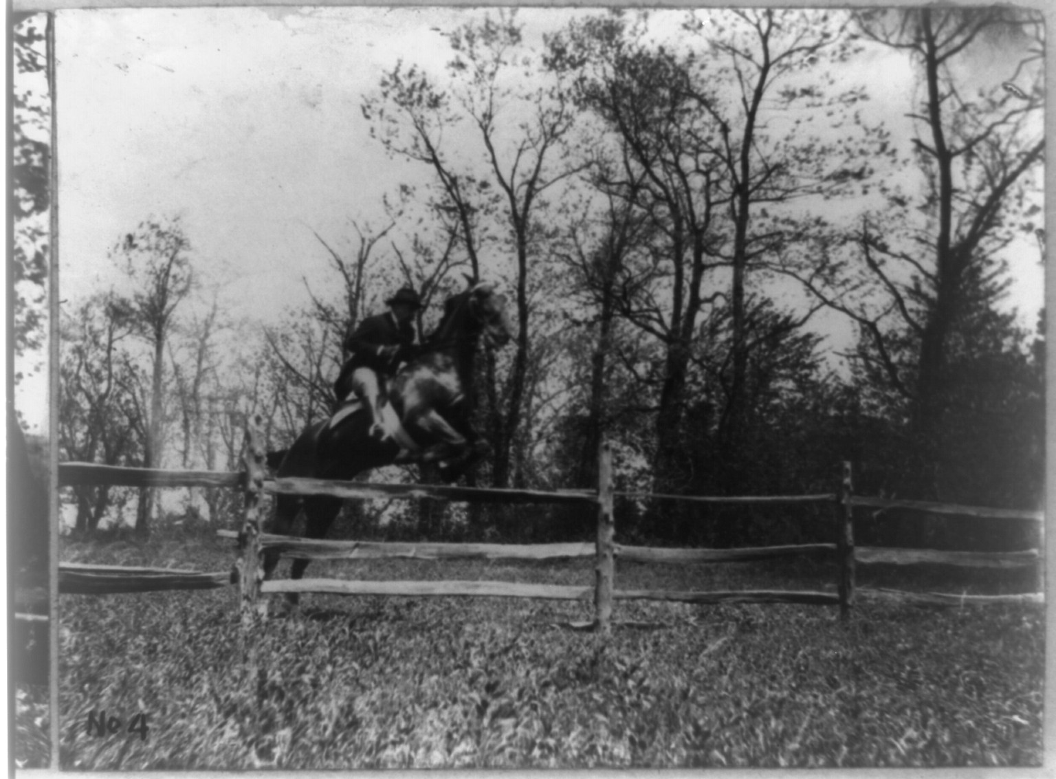 [Theodore Roosevelt, full-length portrait, on horseback, facing right; jumping fence], c1902. — historic photograph