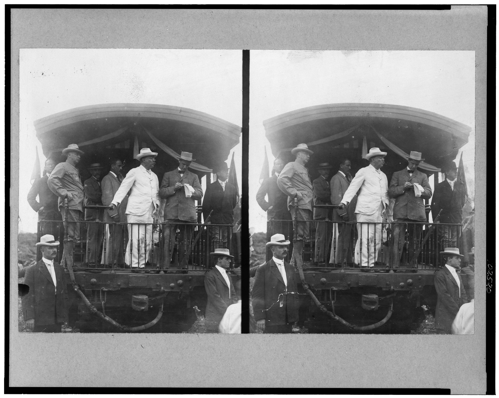 [Theodore Roosevelt, standing on back of railroad car, speaking toward crowd], c1907. — historic photograph