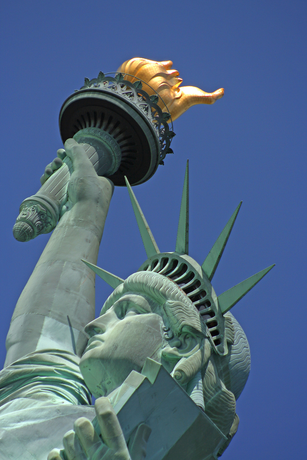 Statue of Liberty torch and head seen from below — historic image