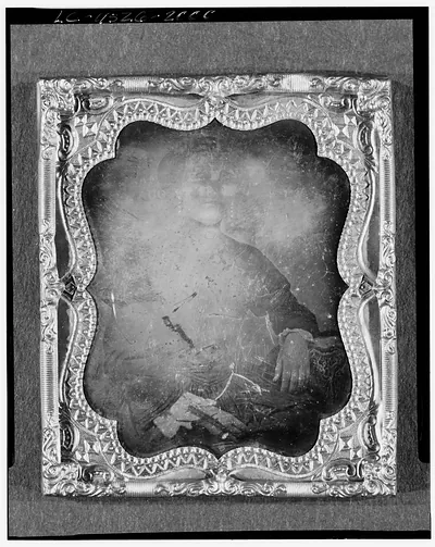 Daguerreotype portrait of a seated figure in ornate case