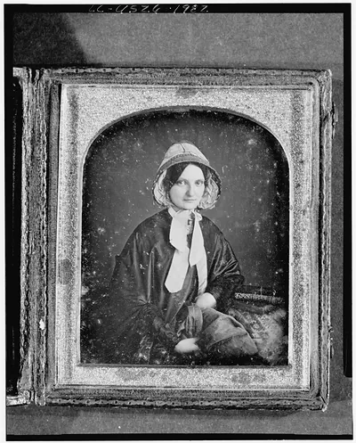 Unidentified woman in bonnet, seated daguerreotype portrait