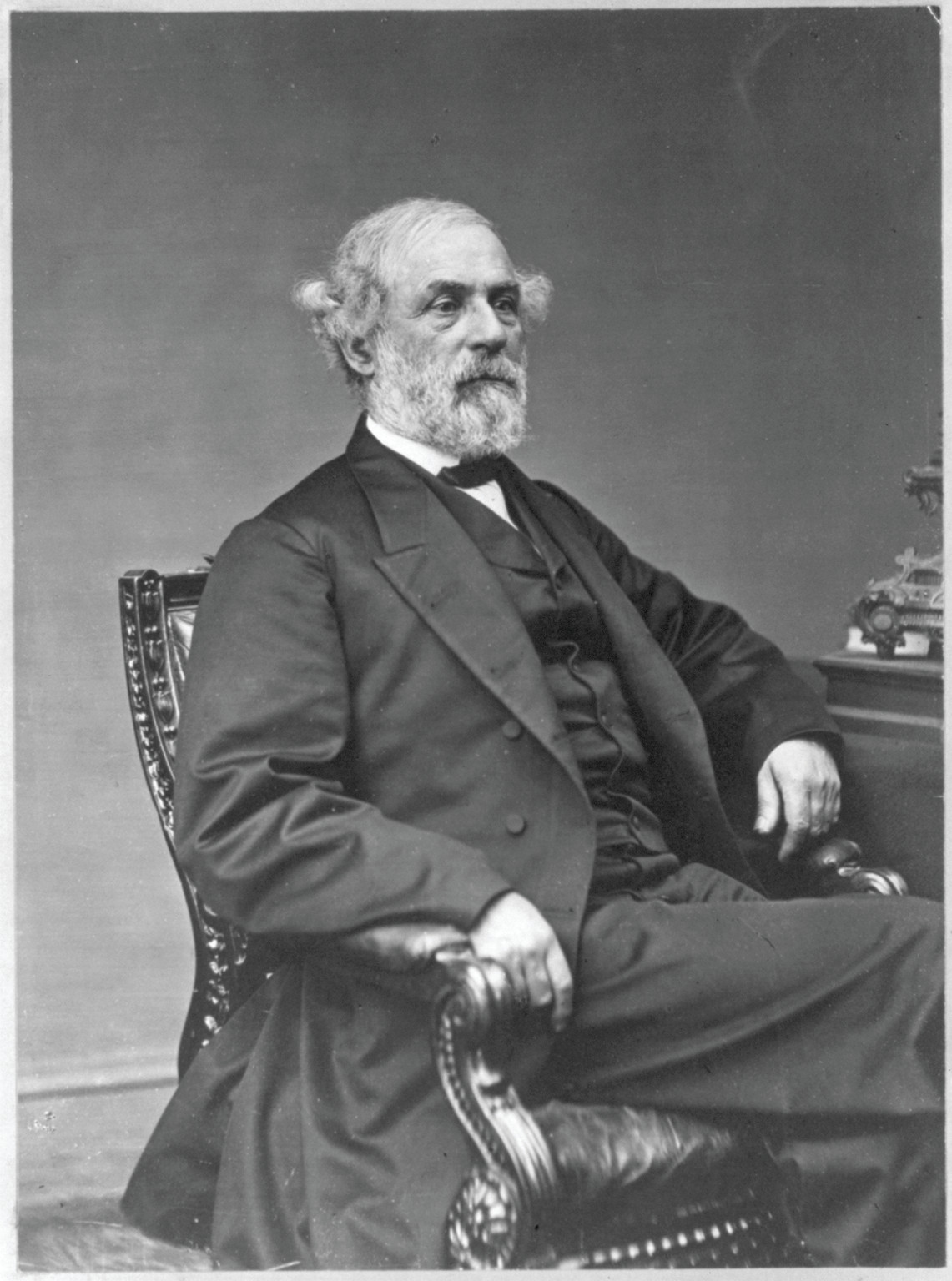[Robert Edward Lee, three-quarter length portrait, seated, facing right] / Handy photo., [1869 May] — historic photograph