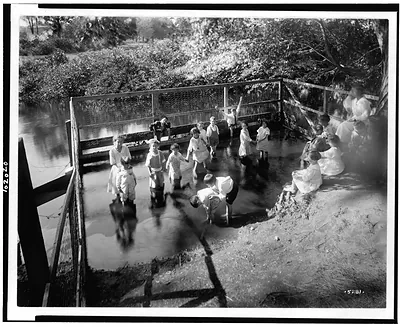 The Wading pool at the children's health camp, where hundreds of under-nourished aenemic, pre-tubercular children have been given the advantages of good and adequate food, fresh air, out-door play, proper rest, etc.