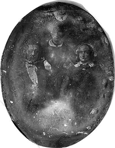 [Unidentified man and woman, both about 35 years of age, with a girl about 15 years of age, man and woman three-quarter length portrait, seated, the man nearly facing front, the woman slightly to the left, holding hands; standing between them, facing front, is the girl]