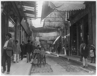[Cuba - Havana - looking down O'Reilly St., narrow street shaded by awnings]