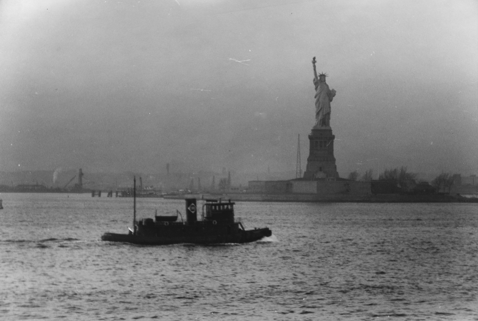Statue of Liberty seen from the S.S. Coamo leaving New York, 1941 Dec. — historic photograph