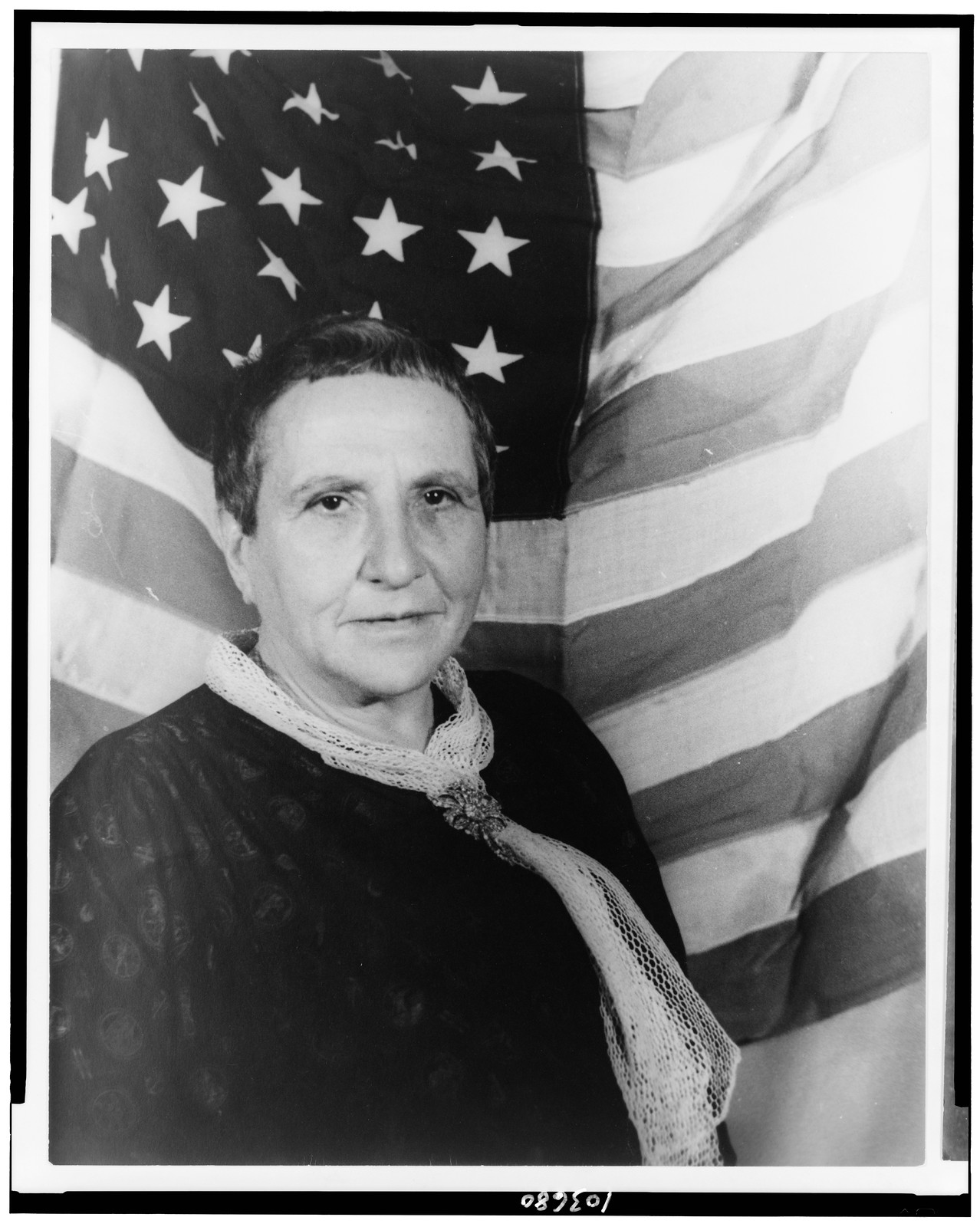 [Portrait of Gertrude Stein, with American flag as backdrop], 1935 Jan. 4. — historic photograph