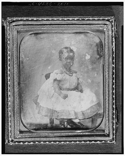 [Mabel Hubbard as a girl, full-length portrait, seated on chair]