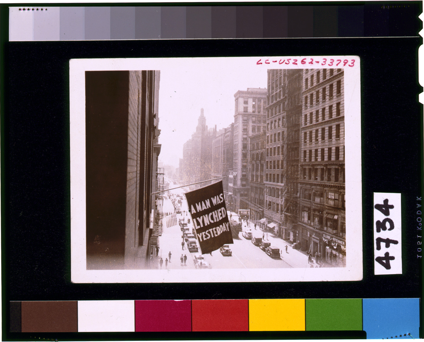 [Flag, announcing lynching, flown from the window of the NAACP headquarters on 69 Fifth Ave., New York City] — historic photograph