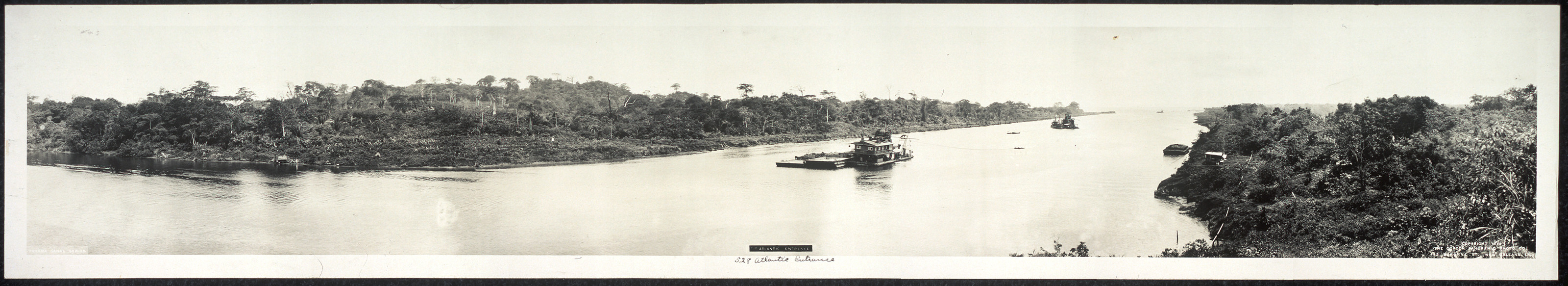 Panoramic view of a jungle river with a barge — historic image