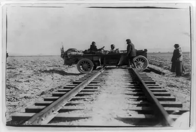 [Automobile straddling railroad tracks during race between New York and San Francisco]