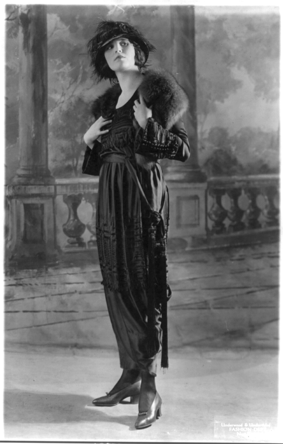 3 women modelling dresses: A frock of Moon Glo Satin B, c1919 Oct. 1. — historic photograph