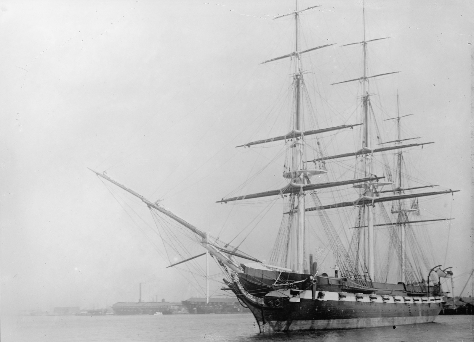 Three-masted sailing warship moored in harbor, black and white photograph — historic photograph