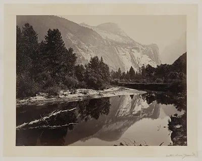 Granite dome reflected in still river, Yosemite