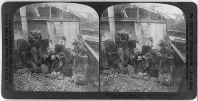 Negro woman carrying coal at a penny a basket from lighter to steamer, Cristobal, Panama